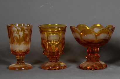 null Set of three goblets on feet and two glasses on feet in transparent orange bohemian...
