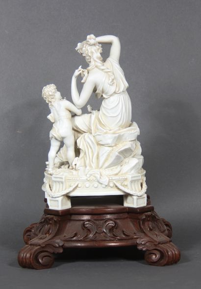 null Bisque group representing a young woman surrounded by two cherubs. 

It rests...