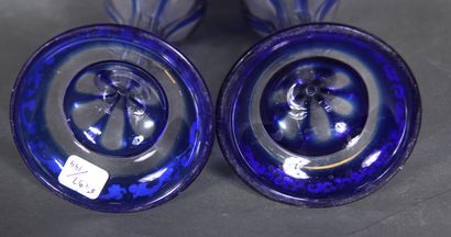 null A pair of transparent and blue overlay glass tulip vases on a pedestal with...
