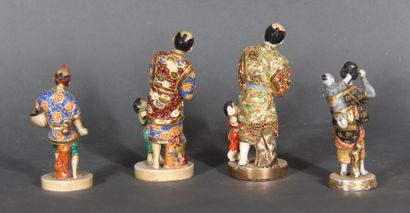 null Four polychrome and gilt porcelain statuettes, Japan. 

Height of the largest:...