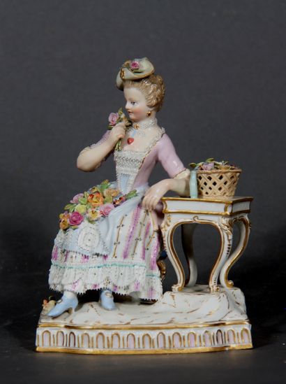 null MEISSEN 

Young girl with roses.

Group in polychrome and gilded porcelain,...