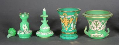 null A green opaline lot including covered flasks and vases, some with white and...