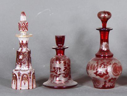 null Set of glass and transparent red crystal bottles engraved with rocaille, vines...
