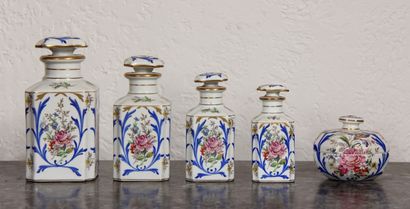 null LIMOGES

Four porcelain bottles and a covered candy box with polychrome decoration...