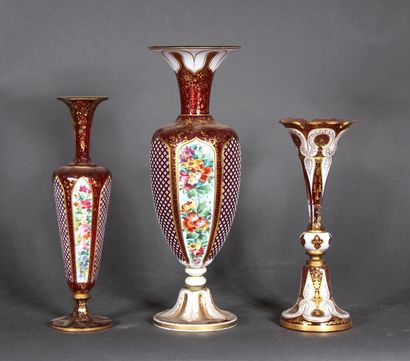 null Two baluster vases and a tulip vase on a pedestal in red transparent overlay...