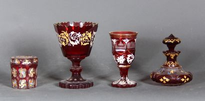 null A transparent red glass lot with white, gilded and polychrome enamelled decoration,...