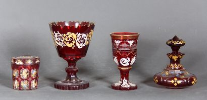 null A transparent red glass lot with white, gilded and polychrome enamelled decoration,...