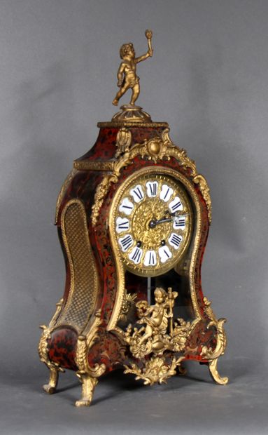 null Brass ball marquetry clock in imitation of tortoiseshell, pediment topped by...