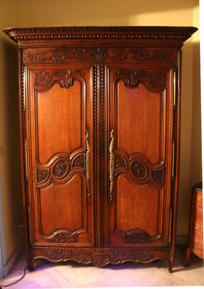 null Wedding wardrobe in natural wood, moulded and carved with birds, baskets and...