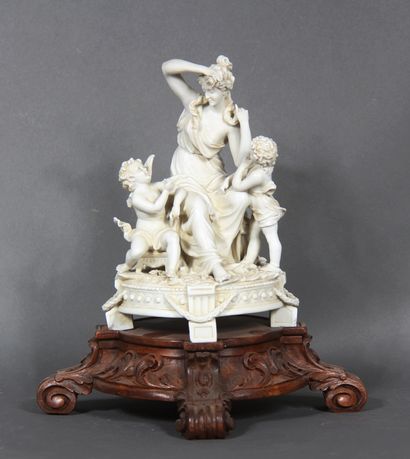 null Bisque group representing a young woman surrounded by two cherubs. 

It rests...