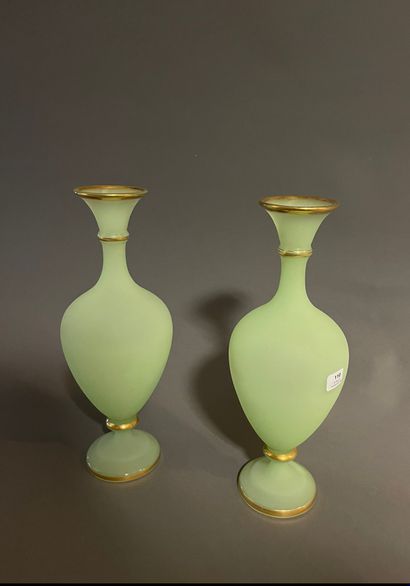 null A pair of green opaline vase on a pedestal and a cup on a pedestal with gold...