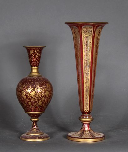 null A tulip vase on a pedestal and a globular vase with a flared neck on a pedestal...