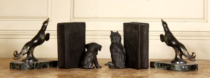 null A pair of patinated bronze bookends representing an animal, marble base

H :...