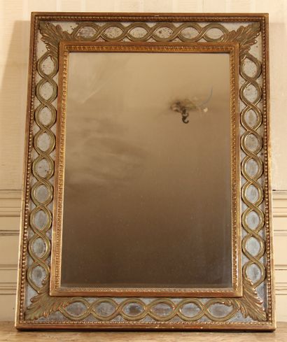 null Rectangular gilded wood mirror with a frieze of interlaces and palmettes

72...