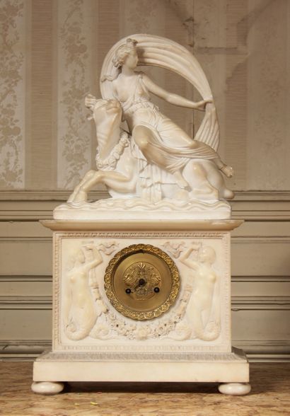 null A moulded and carved alabaster clock, topped by a group representing the abduction...