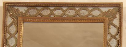 null Rectangular gilded wood mirror with a frieze of interlaces and palmettes

72...