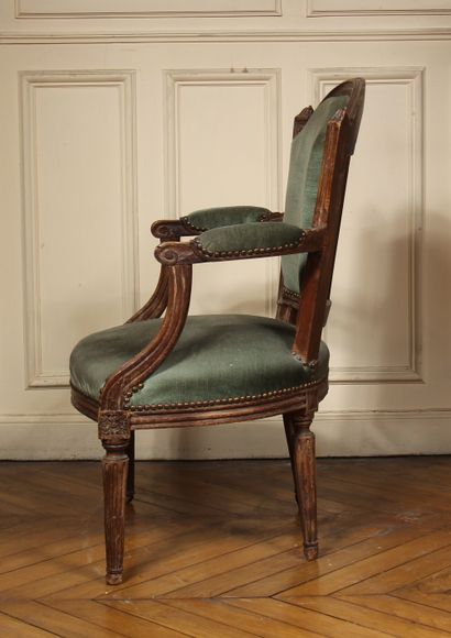 null Natural wood moulded cabriolet armchair with fluted tapered legs, Louis XVI...