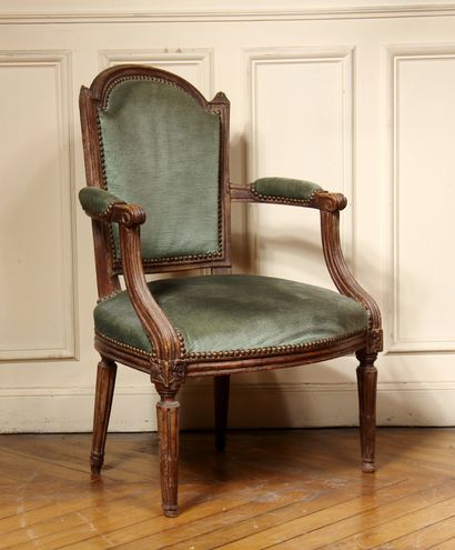 null Natural wood moulded cabriolet armchair with fluted tapered legs, Louis XVI...