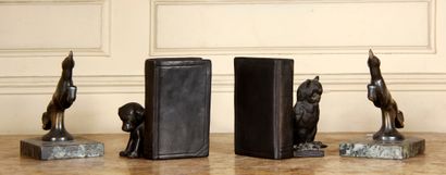 null A pair of patinated bronze bookends representing an animal, marble base

H :...