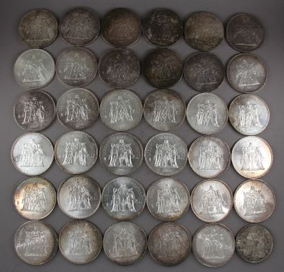 null Thirty five 50 FF coins and one 10 FF Hercules coin in silver