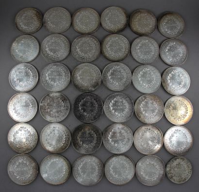 null Thirty five 50 FF coins and one 10 FF Hercules coin in silver