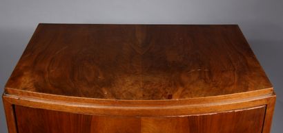 null Mahogany veneered convex bar with a revolving leaf featuring glass shelves,...
