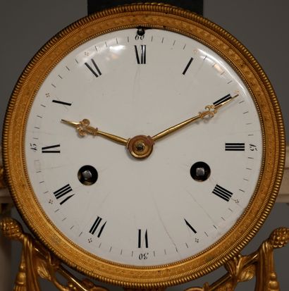 null A white marble and ormolu portico clock resting on four feet, the movement surmounted...