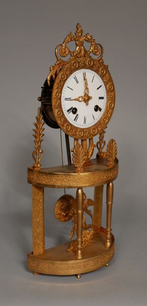 null Small gilt bronze and brass portico clock with palmettes, lyre, Eros, wire movement...