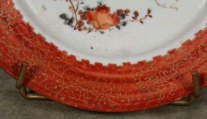 null Porcelain plate with red marli and gilt decoration, the center with branches...