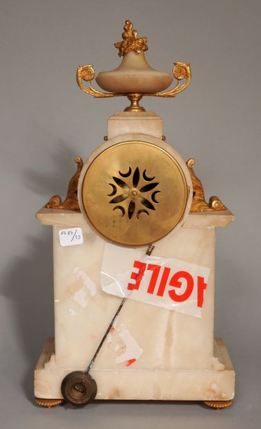 null Alabaster and bronze clock surmounted by a flowering urn with two handles, four...