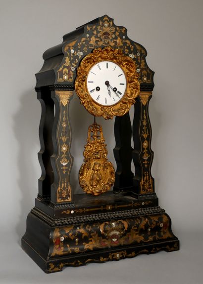 null A Louis-Philippe period ebony, bronze and brass inlaid clock with mother of...