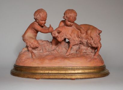 null D'AST

Jeune faune et un putto jouant avec une chèvre 

Sculpture en terre cuite...