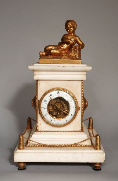 null A white marble clock consisting of a cube resting on a square base decorated...