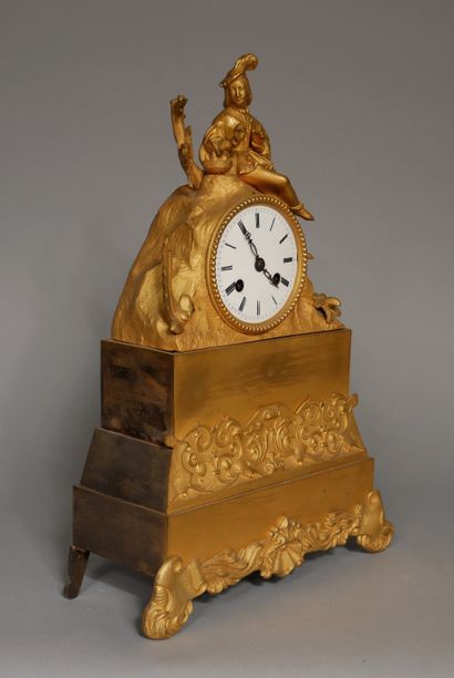 null A romantic ormolu and brass quadripod clock, the movement surmounted by a courtier...