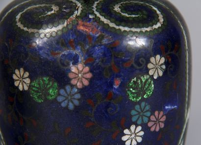 null A pair of cloisonné metal baluster vases with small necks decorated with flowers,...