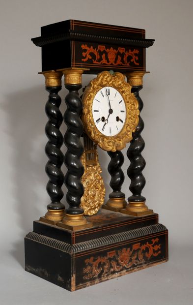 null An ebony veneered portico clock with twisted columns, inlaid with scrolls and...