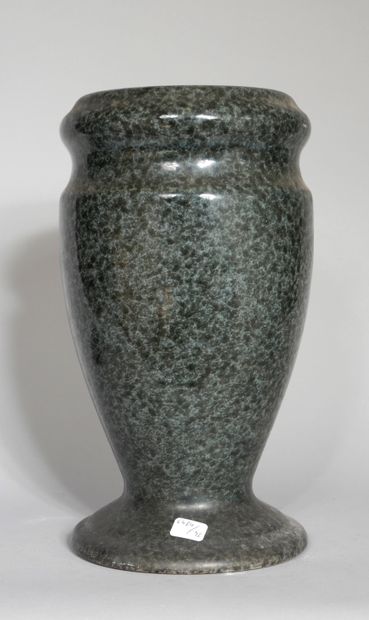 null A stone baluster vase with a blue-grey speckled glaze 

H: 32 cm.