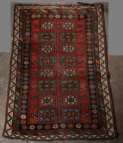 null Carpet with two rows of stars in rectangular medallions

135 x 92 (wear)
