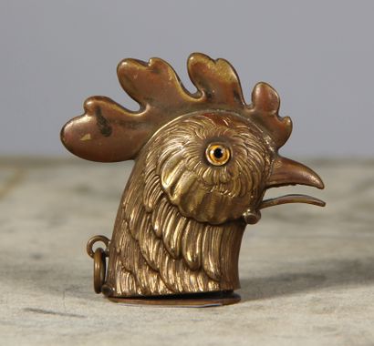 null Metal matchbox in the shape of a rooster's head, the spout with mechanism opening...