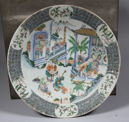 null A polychrome porcelain dish on a heel, decorated with an interior scene, China

D...