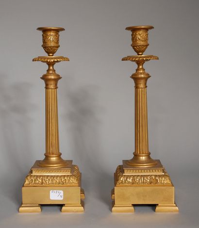 null A pair of bronze candlesticks with a fluted column in the Louis XVI style

H:...