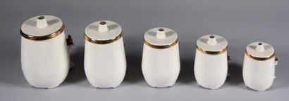 null Five cream and gilded ceramic spice pots in the shape of a hearth (one damaged...