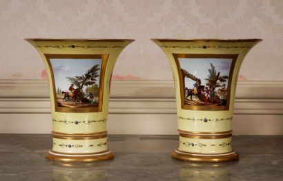 null A pair of tulip vases on a round base in porcelain with a yellow background,...