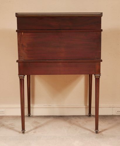 null Mahogany veneered tiered cylinder desk, brass frames, white veined marble top...