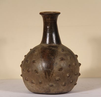 null Vase with long neck

Chimú culture, northern Peru

Late Intermediate, 1100-1450...