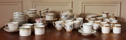 null Set of mismatched porcelain cups and saucers