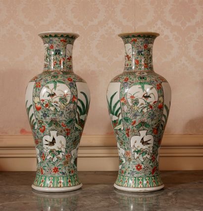 null Pair of polychrome porcelain baluster vases in the green family style (one damaged...