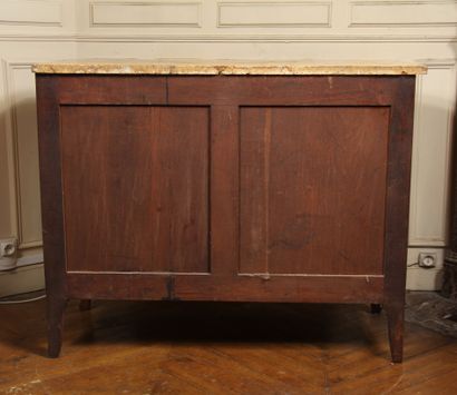 null A scriban chest of drawers in veneer opening to three drawers on three rows,...