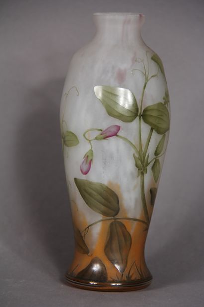 null DAUM Nancy

	A baluster vase with acid-etched and enamelled decoration of foliage...