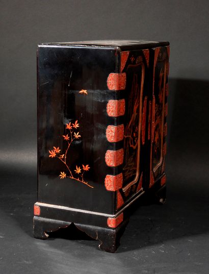 null Black lacquered wood cabinet with gilded decoration of birds and branches, the...